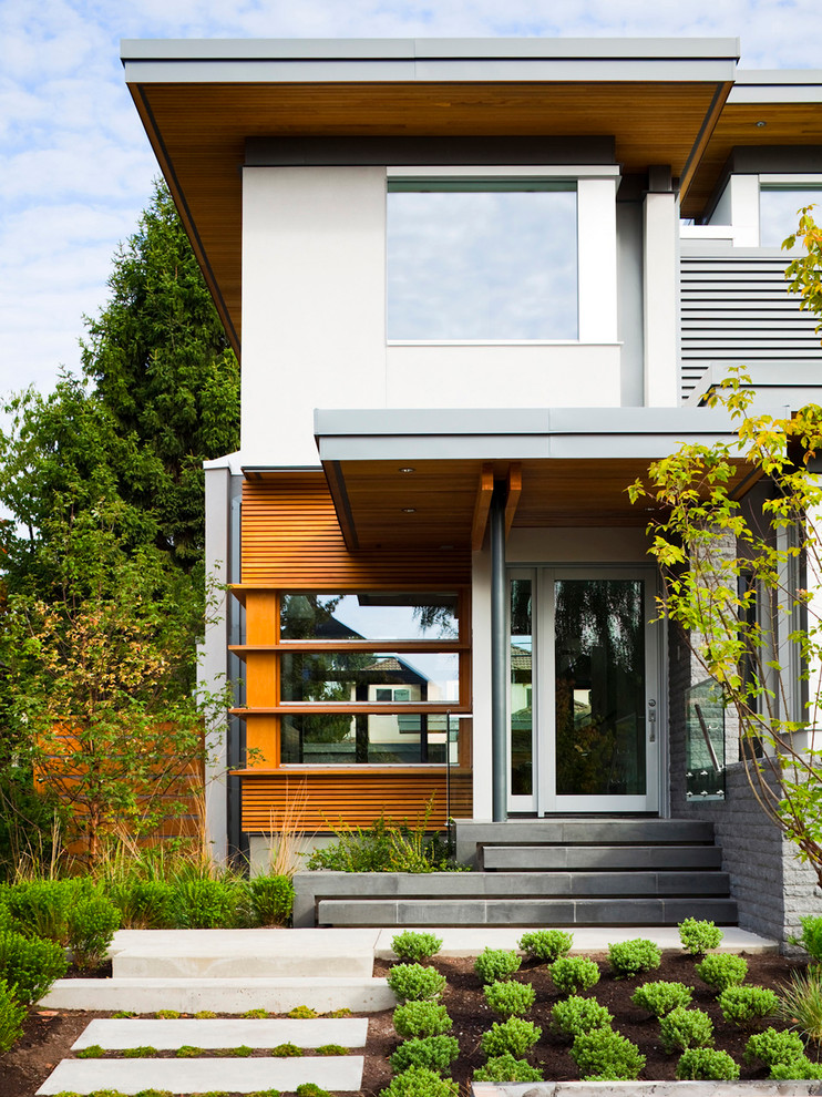 Inspiration for a medium sized contemporary front door in Vancouver with a single front door and a glass front door.