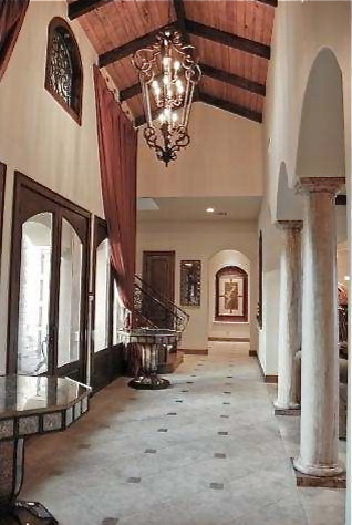 This is an example of an expansive eclectic foyer in Austin with beige walls, travertine flooring, a double front door and a glass front door.