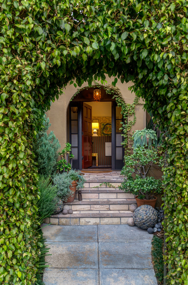 Design ideas for a traditional front door in Los Angeles with a red front door.