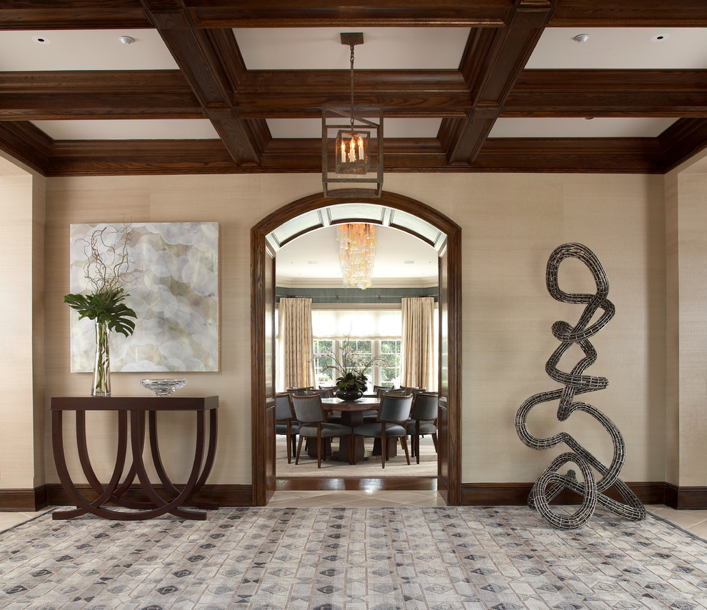This is an example of a large rustic foyer in New York with beige walls.