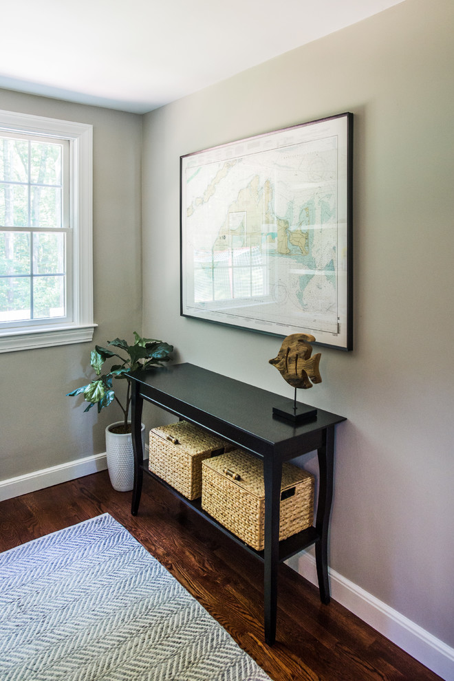 Mudroom - small transitional medium tone wood floor and brown floor mudroom idea in Boston with gray walls