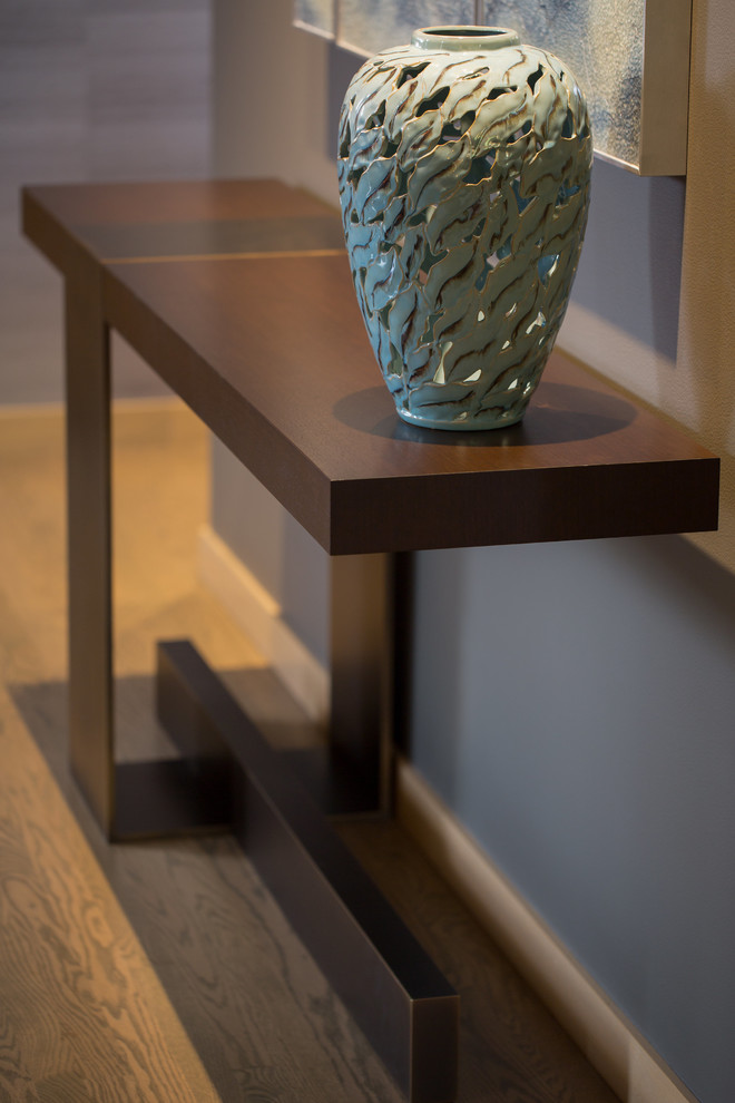 Photo of a large contemporary foyer in Seattle with grey walls, medium hardwood flooring, a single front door, a dark wood front door and brown floors.