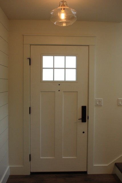 Small beach style vinyl floor entryway photo in Seattle with white walls and a white front door