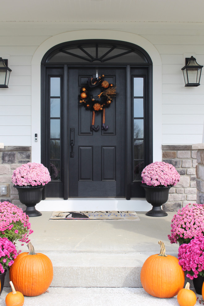 Design ideas for a large classic front door in Other with white walls, concrete flooring, a single front door, a black front door, grey floors, a timber clad ceiling and tongue and groove walls.