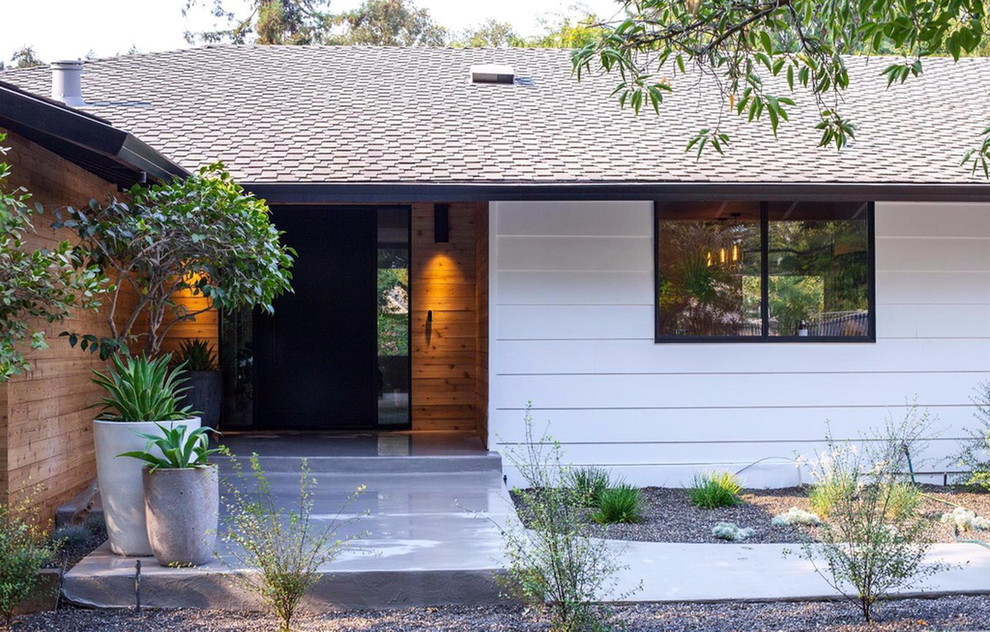 This is an example of a modern front door in Sacramento with a single front door and a black front door.