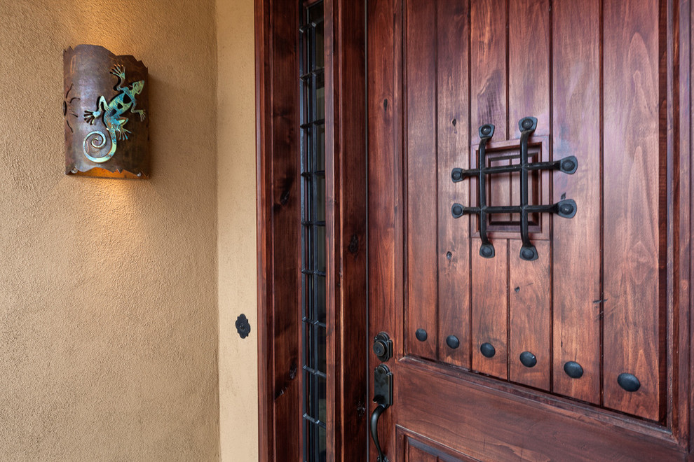 Inspiration for a medium sized front door in Phoenix with beige walls, a single front door and a dark wood front door.