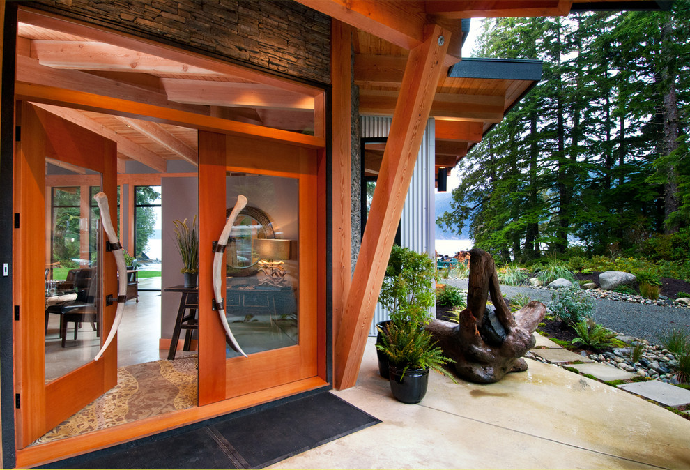 This is an example of a contemporary front door in Vancouver with a double front door and a glass front door.