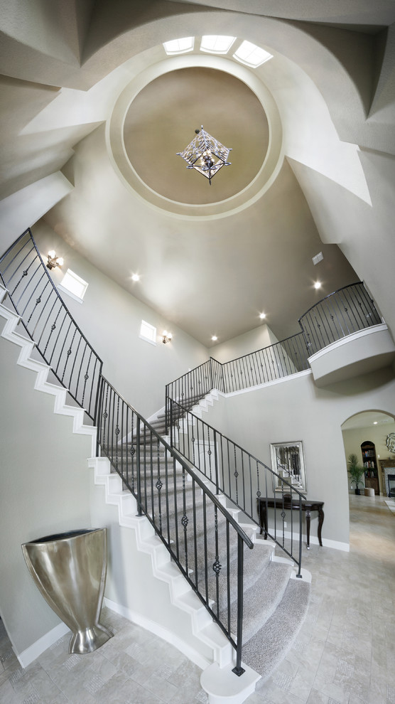 Foyer - large transitional porcelain tile foyer idea in Austin with gray walls