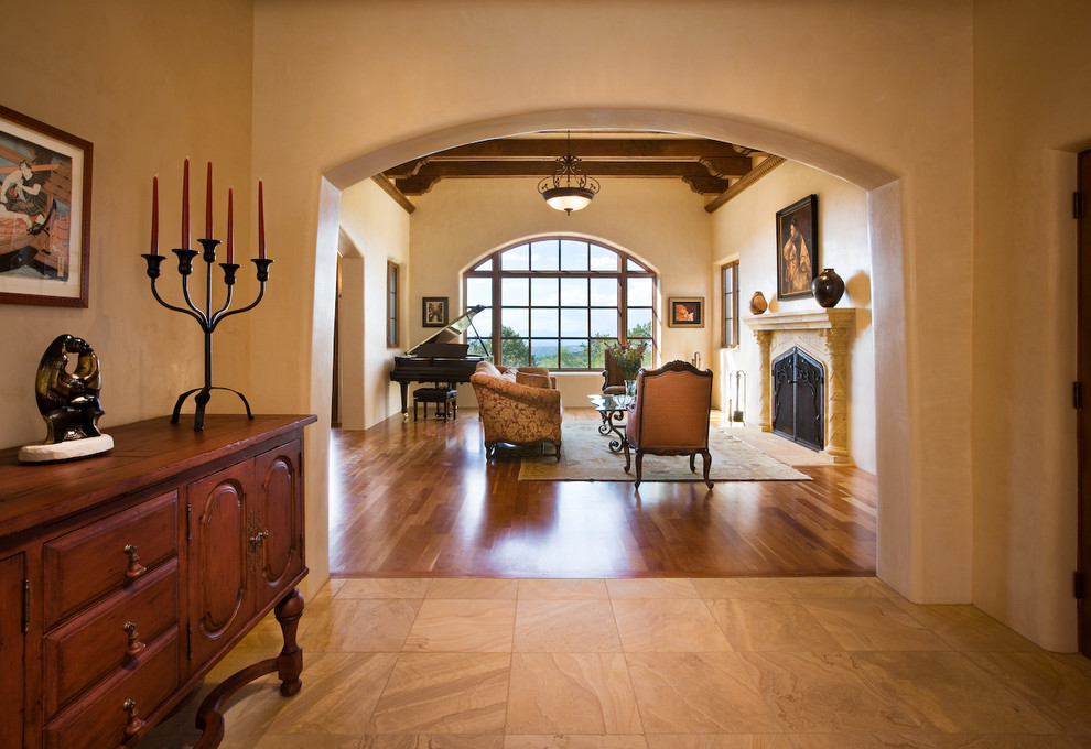 Inspiration for a mid-sized timeless travertine floor foyer remodel in Albuquerque with beige walls