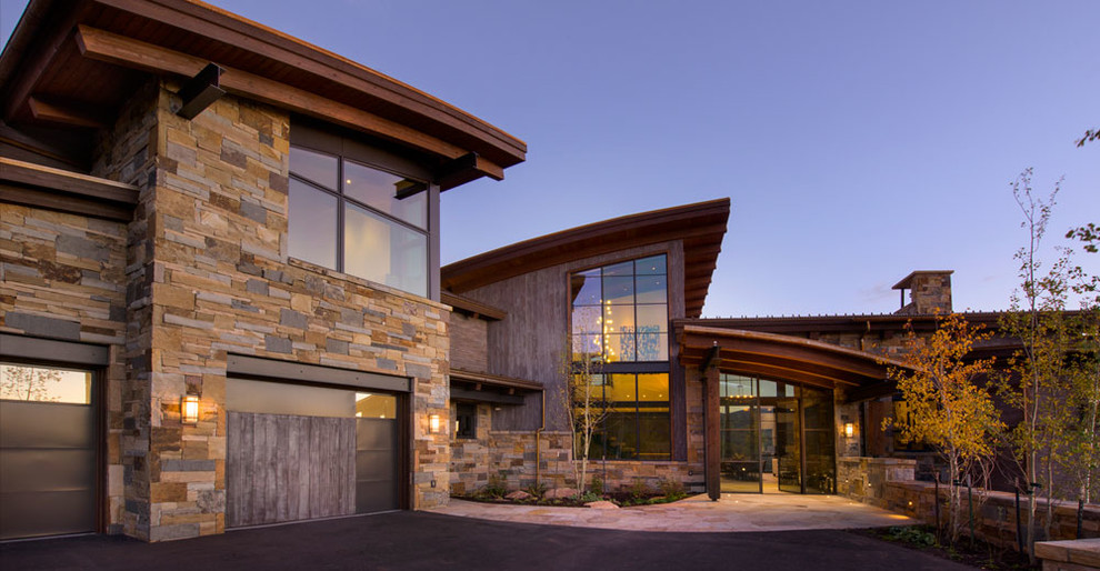 This is an example of a large contemporary front door in Denver with a single front door and a glass front door.
