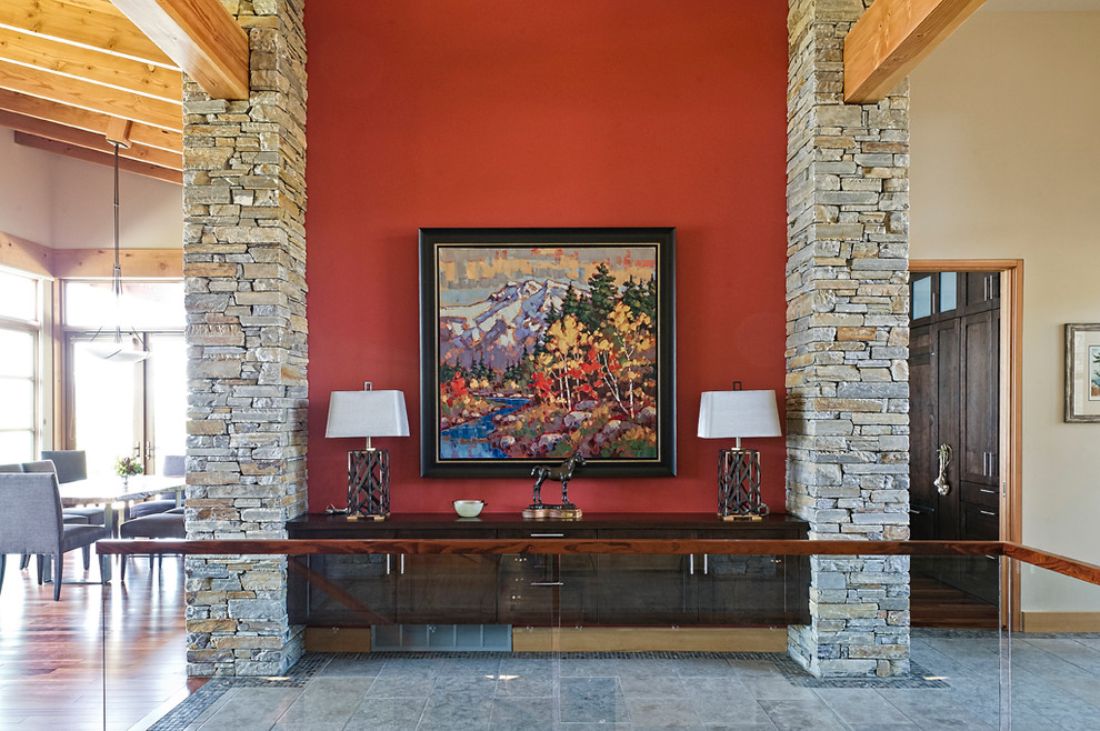 Mid-sized mountain style porcelain tile and gray floor entryway photo in Vancouver with red walls and a light wood front door