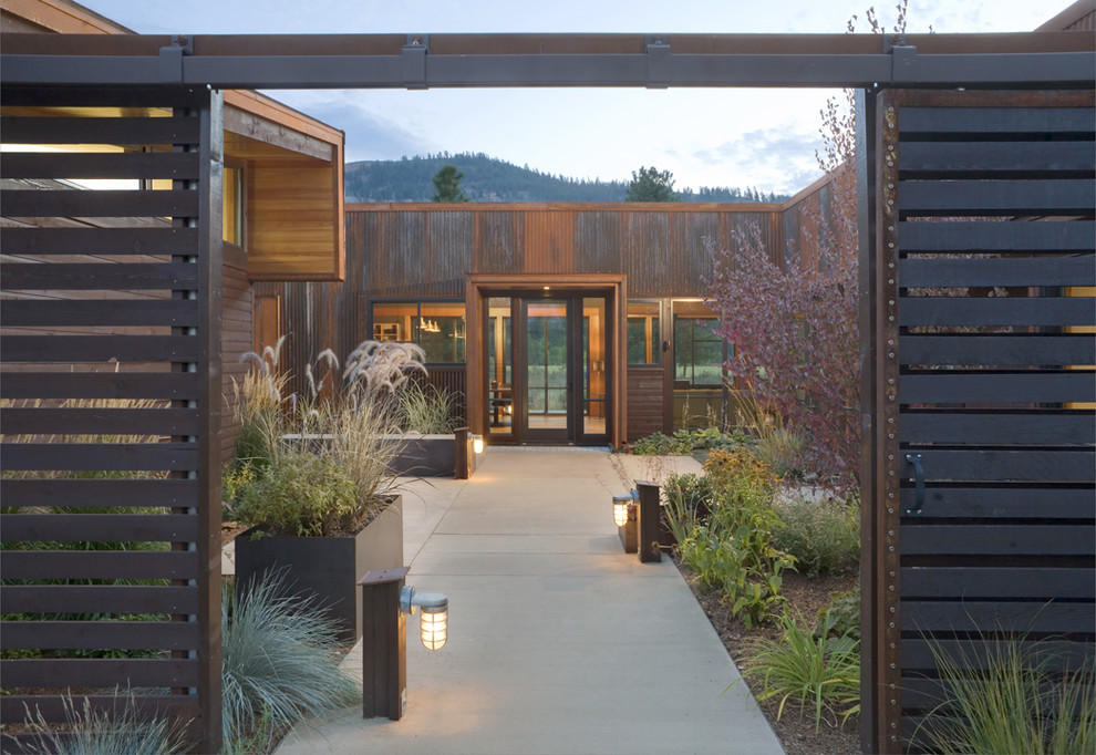 Single front door - large contemporary concrete floor single front door idea in Seattle with a glass front door