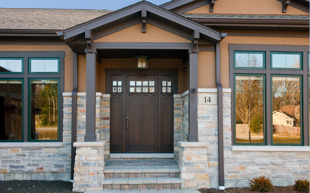 Inspiration for a craftsman single front door remodel in Chicago with a dark wood front door