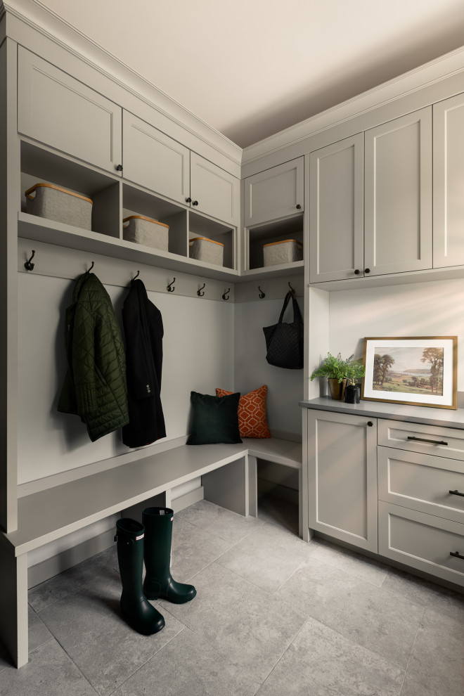 Example of a mid-sized transitional travertine floor and multicolored floor mudroom design in Chicago with white walls