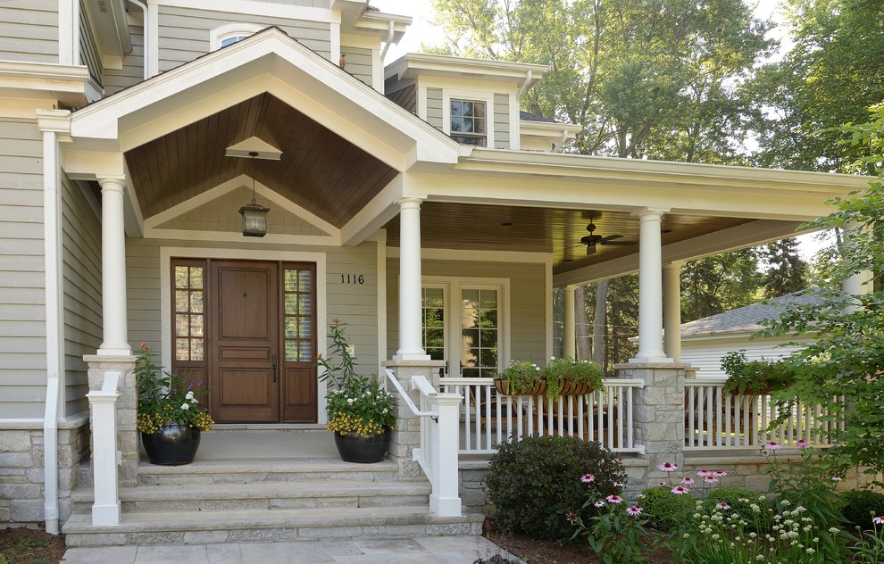 Inspiration for a timeless single front door remodel in Chicago with a dark wood front door
