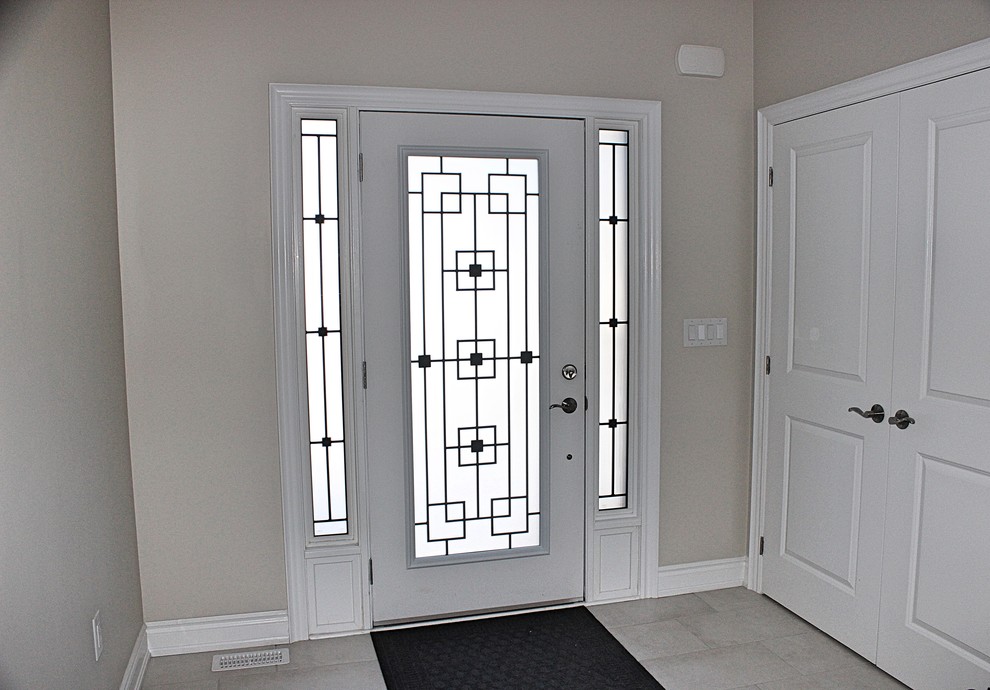 Photo of a contemporary front door in Toronto with a single front door.