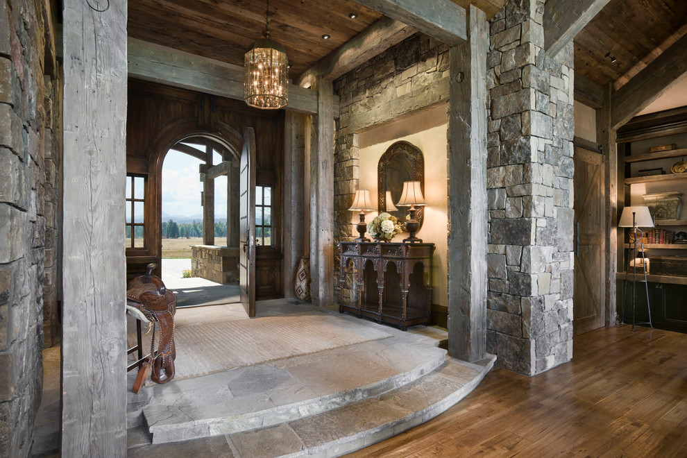 Mountain style entryway photo in Other with a dark wood front door