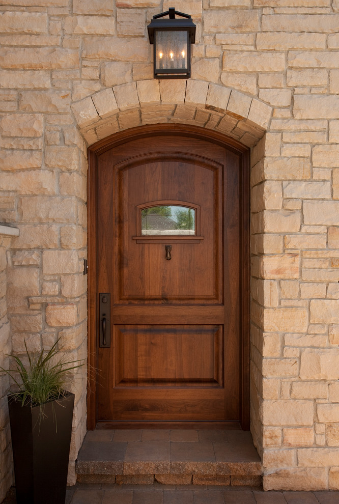 Large transitional entryway photo in Salt Lake City with a medium wood front door