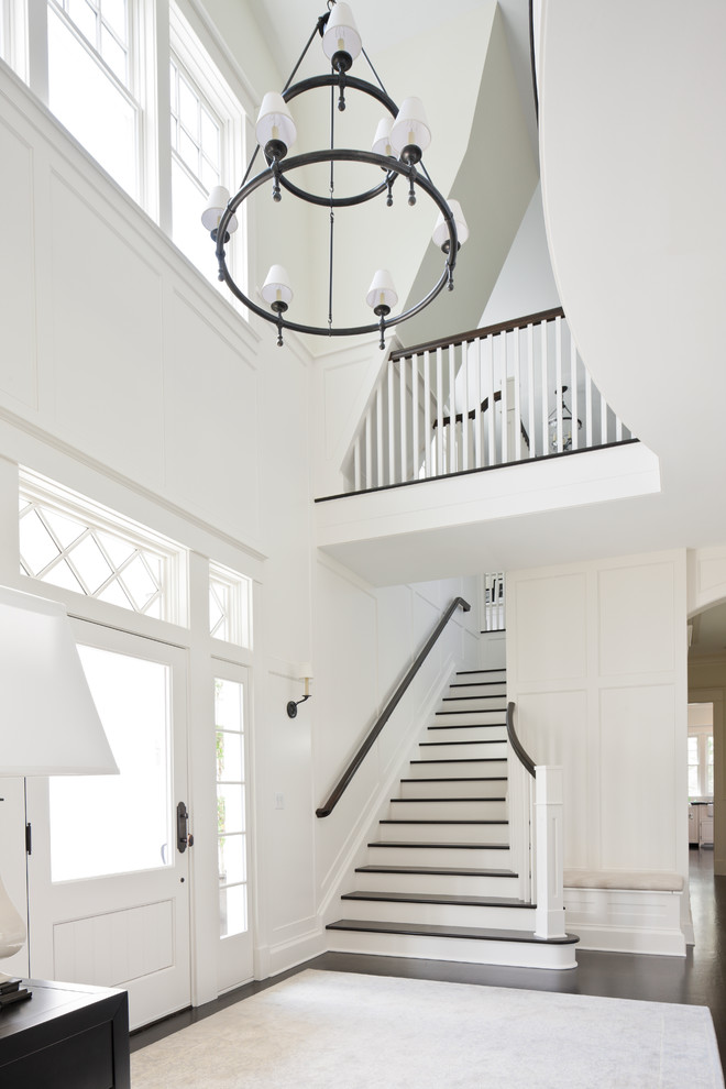 Example of a classic entryway design in Seattle with white walls