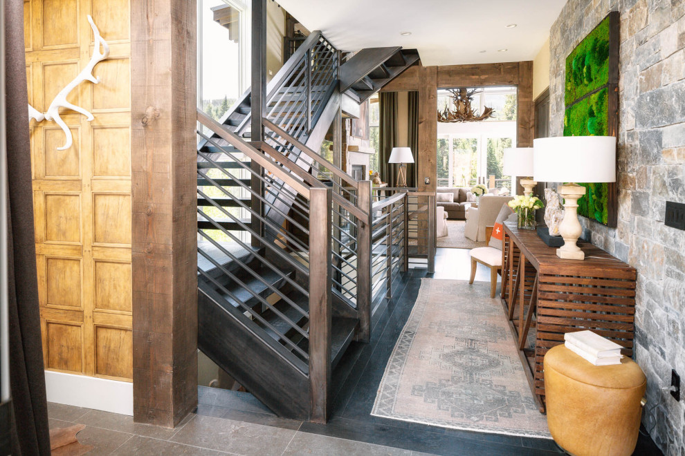 Inspiration for a large rustic foyer in Other with slate flooring and black floors.