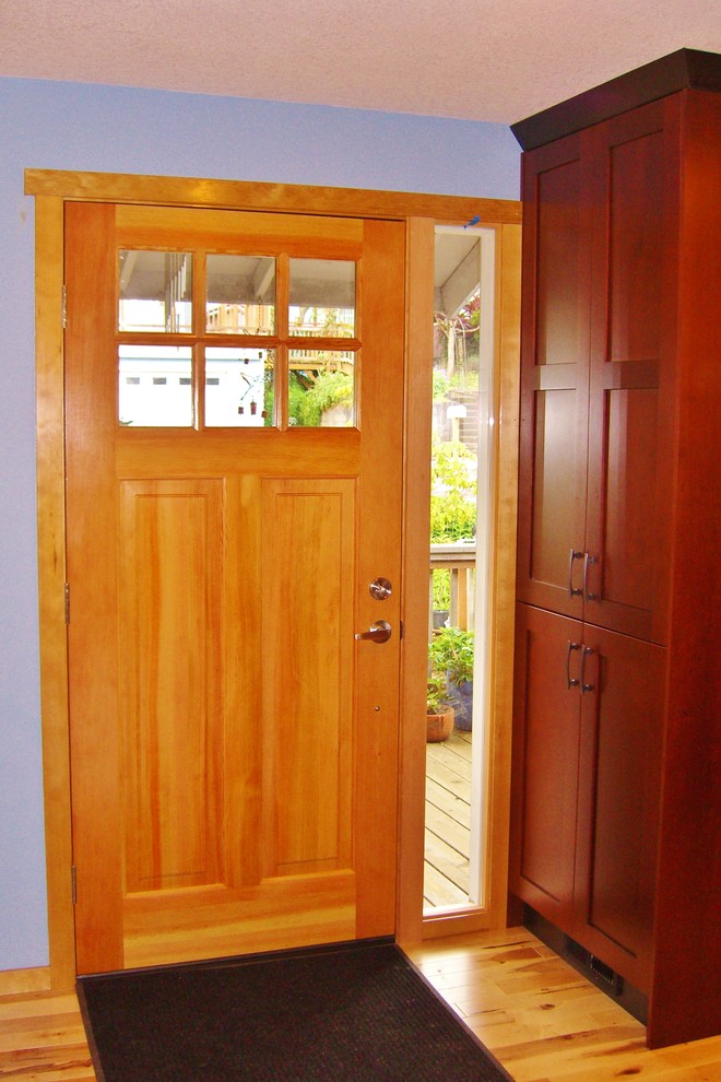 Inspiration for a medium sized classic front door in Portland with blue walls, light hardwood flooring, a single front door, a medium wood front door and beige floors.
