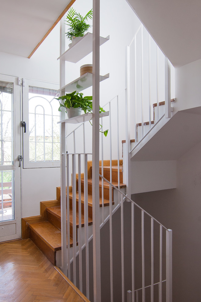 Staircase - scandinavian wooden u-shaped metal railing staircase idea in Other with wooden risers