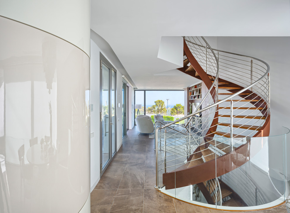 Inspiration for a large contemporary wood spiral staircase in Alicante-Costa Blanca with open risers.