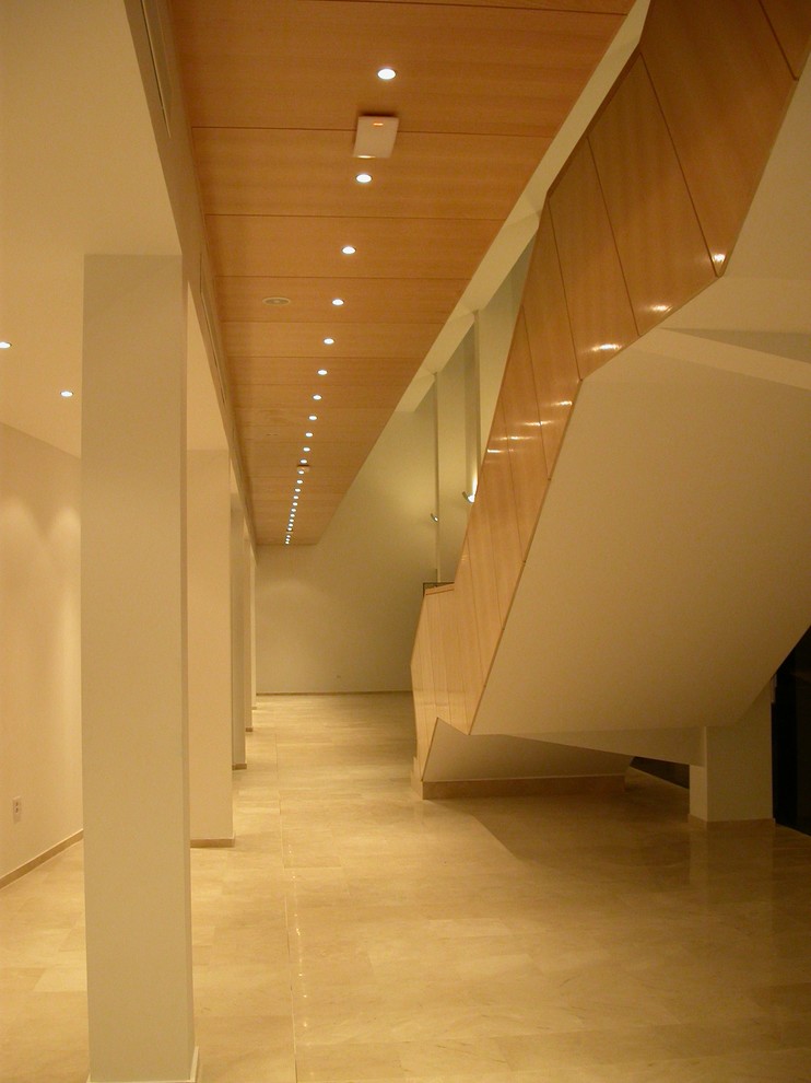 This is an example of an expansive contemporary straight staircase in Other.