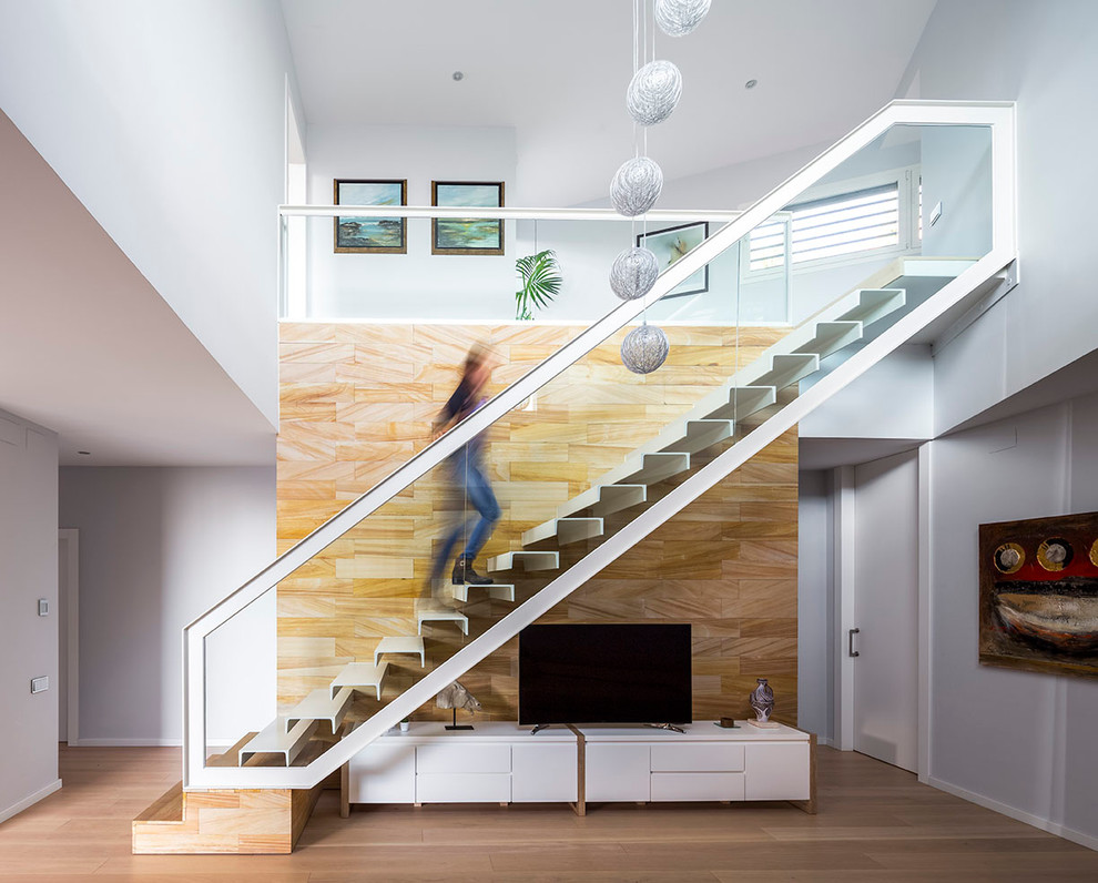 Photo of a medium sized contemporary metal straight staircase in Barcelona with open risers.