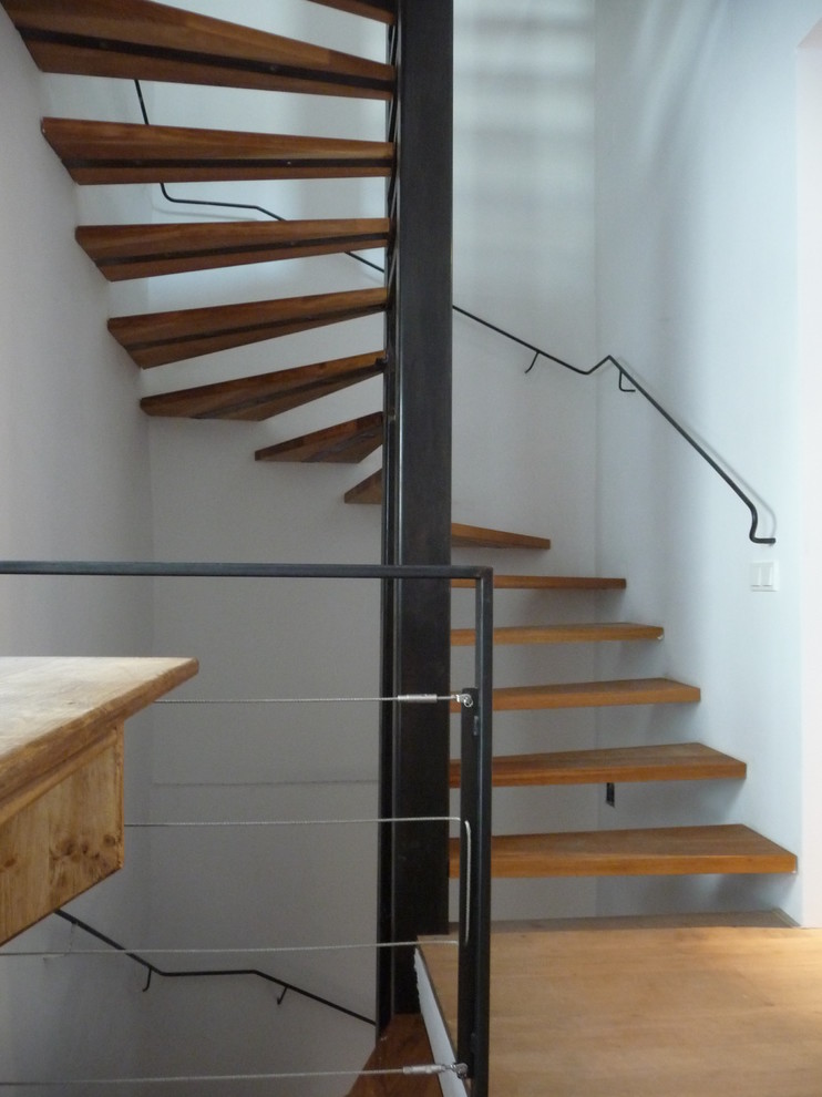 Staircase - large contemporary wooden spiral open staircase idea in Barcelona