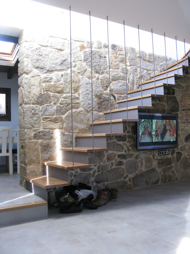 Design ideas for a medium sized rustic concrete straight staircase in Other.