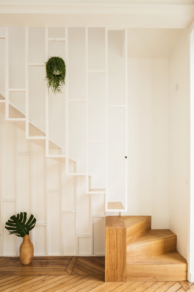 Inspiration for a small contemporary wood staircase in Paris with open risers.