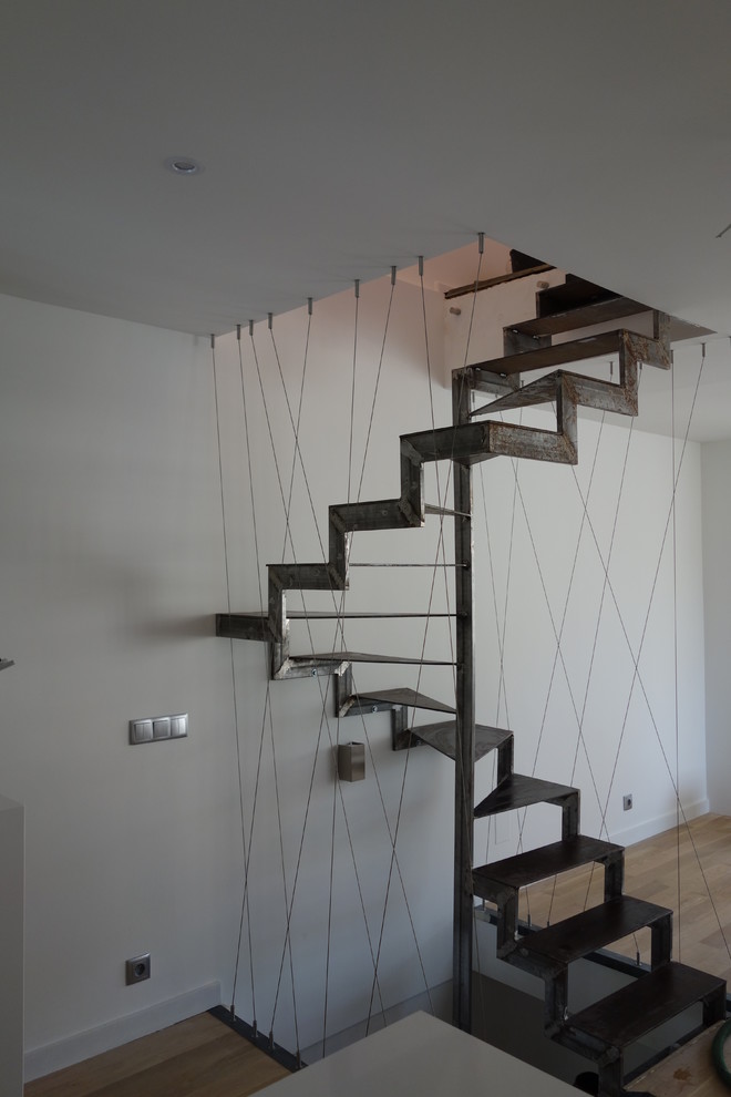 Inspiration for an industrial staircase remodel in Paris