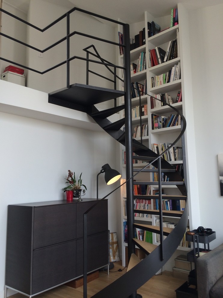 Example of a mid-sized trendy wooden spiral open staircase design in Paris