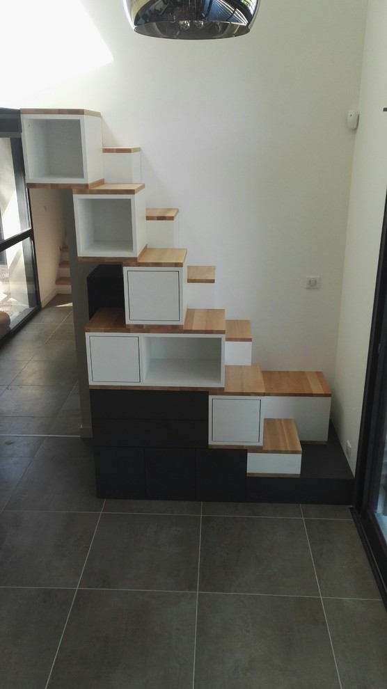 Staircase - modern wooden staircase idea in Lyon