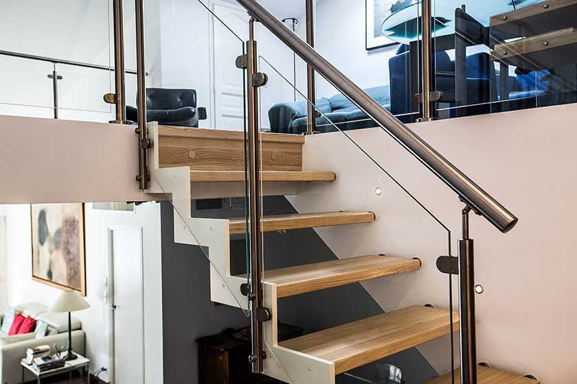 Inspiration for a contemporary wood straight staircase in Nice.