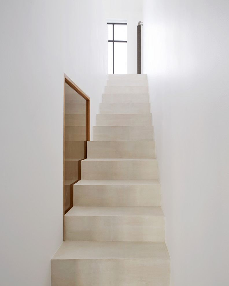 На фото: прямая бетонная лестница среднего размера в современном стиле с бетонными ступенями с