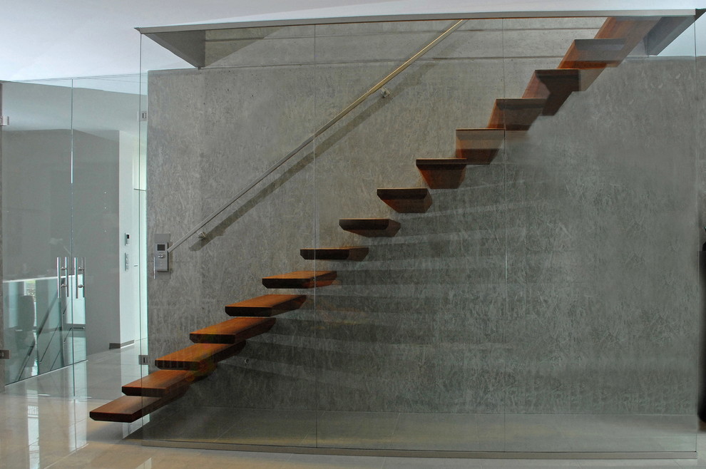 Idées déco pour un escalier flottant moderne avec des marches en bois.