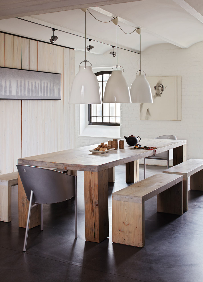 Inspiration for a contemporary dining room in Munich with white walls.