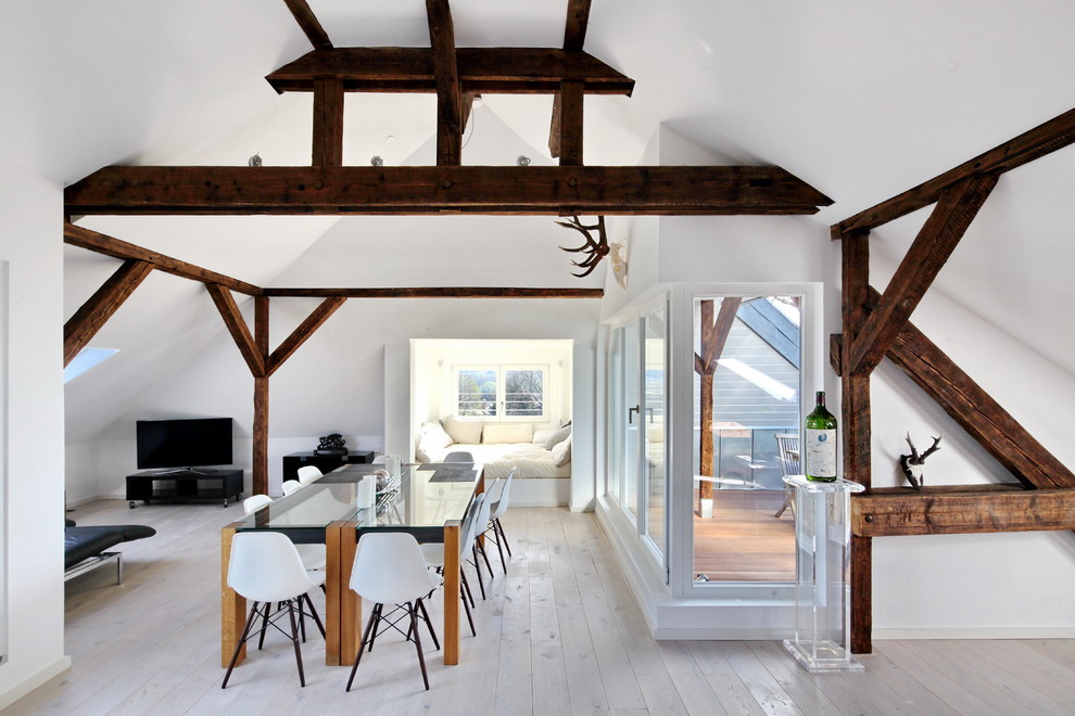 Inspiration for a large scandi open plan dining room in Cologne with white walls and light hardwood flooring.