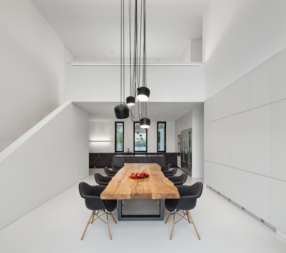Kitchen/dining room combo - large modern kitchen/dining room combo idea in Munich with white walls and no fireplace