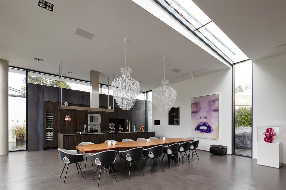 This is an example of a large contemporary open plan dining room in Cologne with vinyl flooring and grey floors.