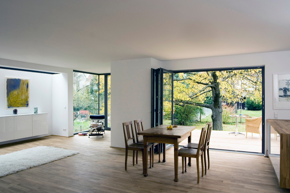 Inspiration for a large contemporary dining room remodel in Stuttgart with white walls