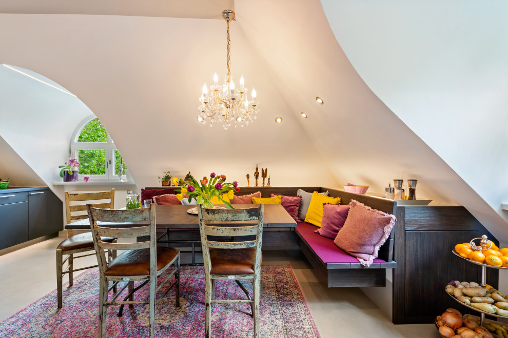 Large contemporary kitchen/dining room in Munich with beige floors.