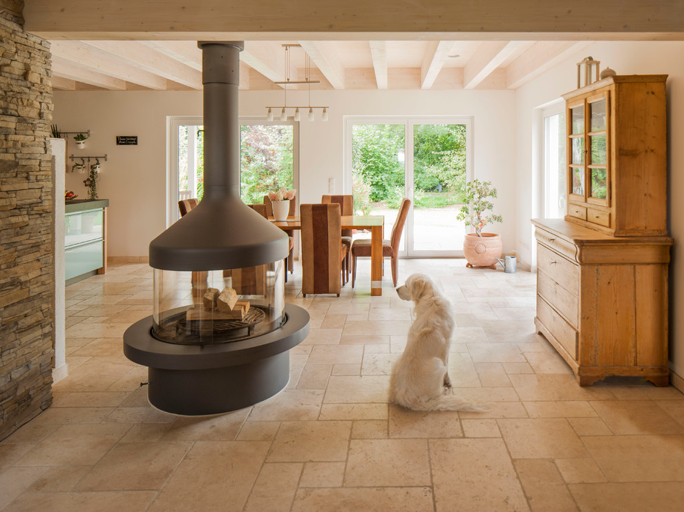 Large trendy travertine floor great room photo in Other with white walls, a two-sided fireplace and a metal fireplace