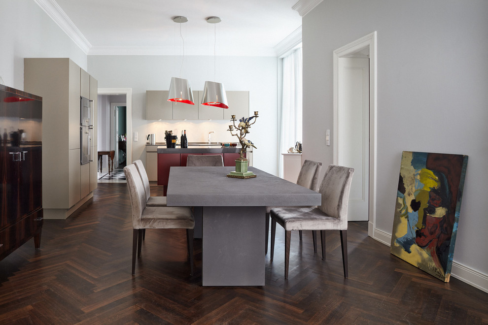 Mid-sized trendy dark wood floor dining room photo in Berlin with gray walls