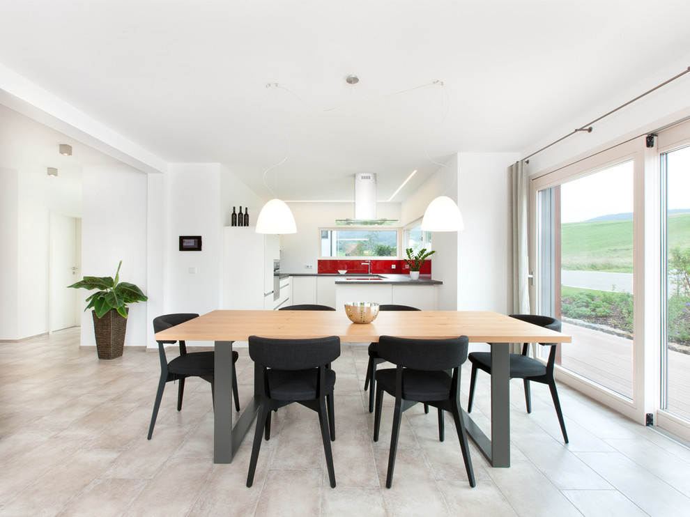 Design ideas for a large contemporary kitchen/dining room in Stuttgart with white walls.