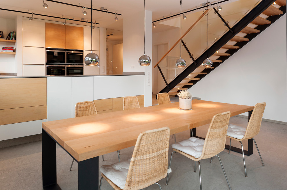 This is an example of a contemporary kitchen/dining room in Hanover with white walls.