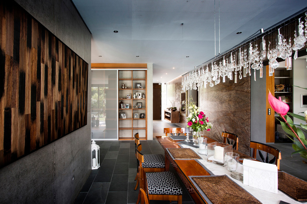 Inspiration for a large contemporary slate floor and black floor dining room remodel with gray walls and no fireplace