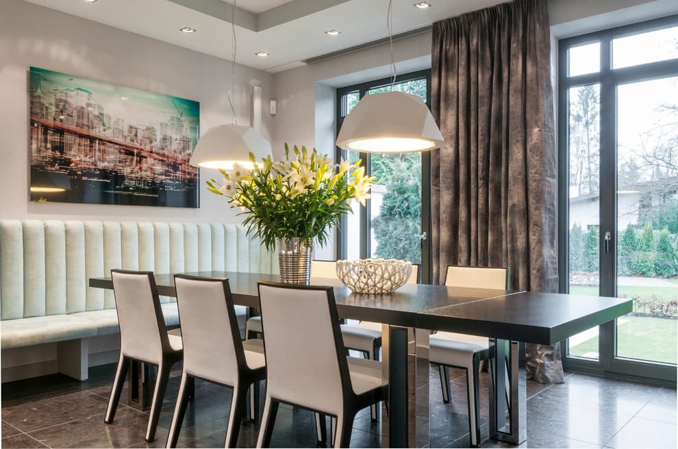 Inspiration for a contemporary dining room remodel in Munich with gray walls